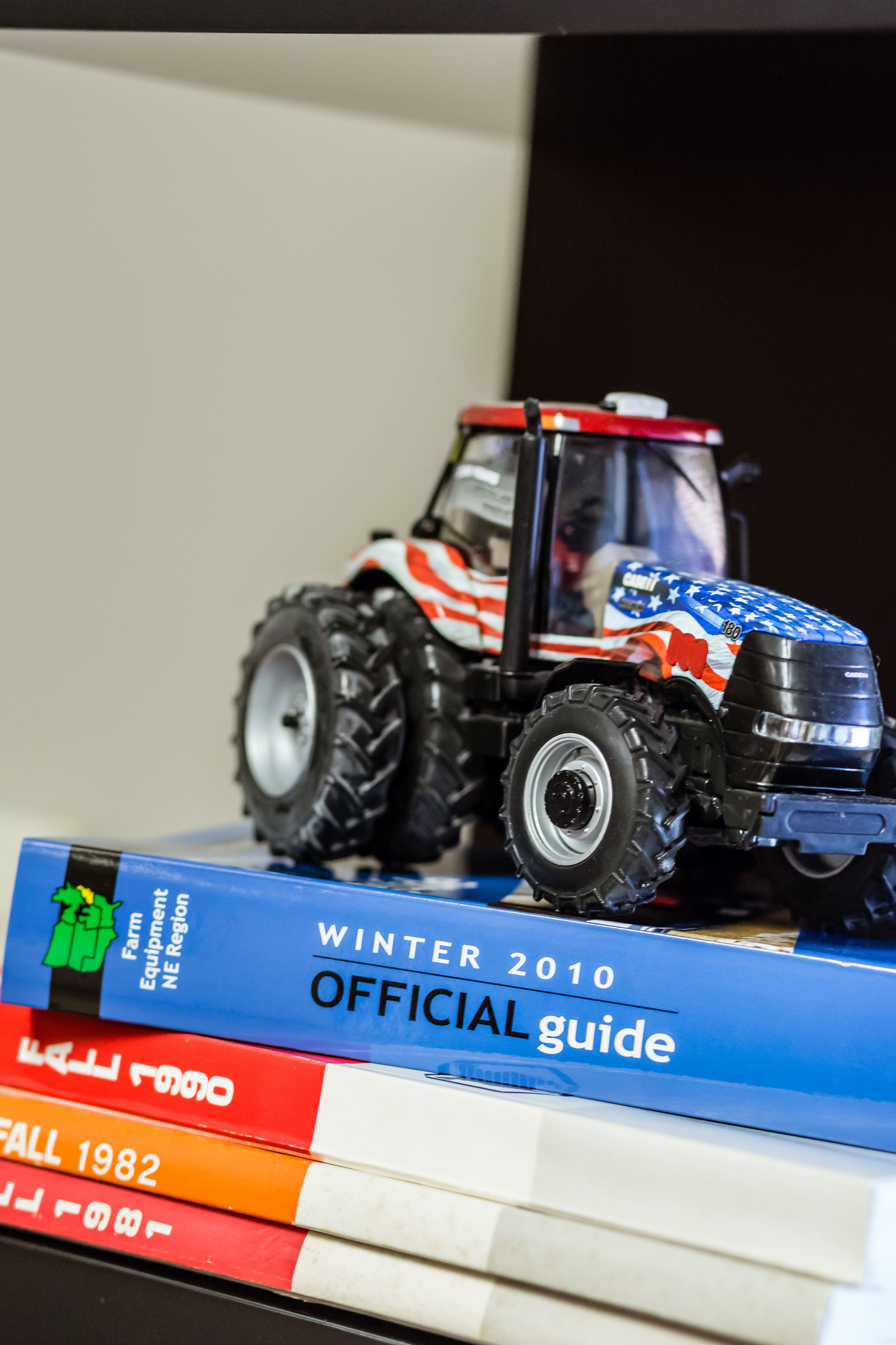 Toy tractor on books